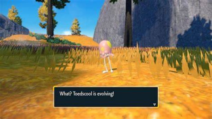 Toedscool standing in a grassy field.